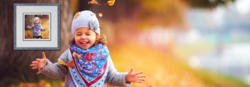 Little girl running in fall leaves
